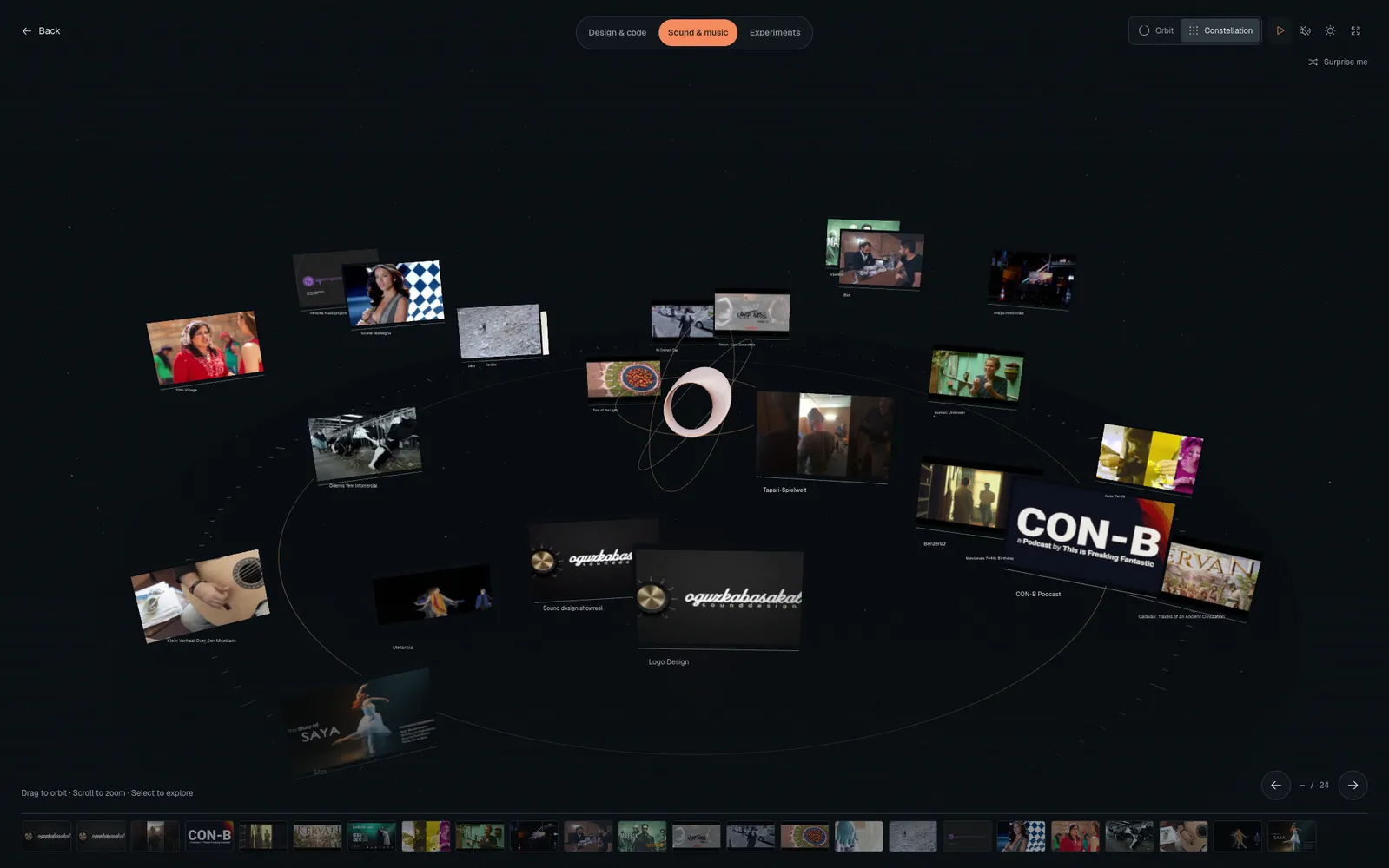 Dark 3D portfolio gallery with project panels arranged around a player